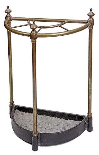 230. Brass and Iron Cane Stand- Late 19th Century- A brass and iron cane stand with original finials and original finish. D- 7” x 16 W” x H 23” $250-$