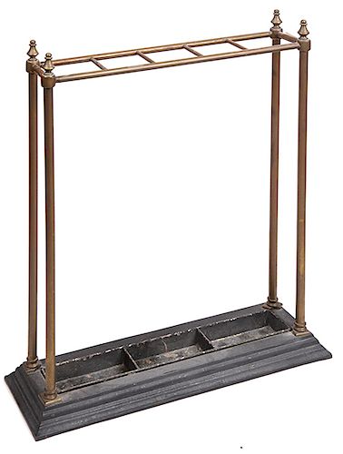 234. Brass Vertical Cane Stand- Ca. 1890- A wonderful example which is solid brass and a cast iron platform base with five divides. 4 ½” x 19” x 27” $