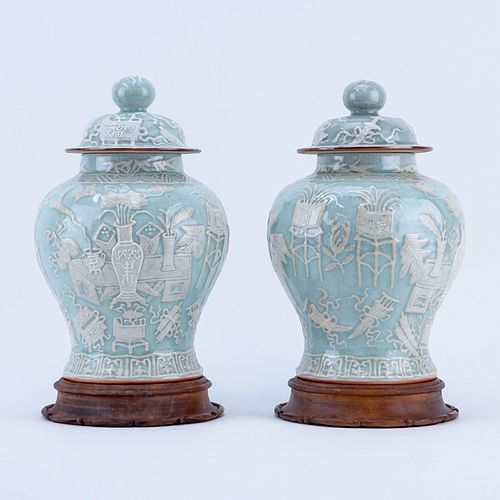 Pair of early to Mid 20th Century Chinese Celadon Glaze Porcelain Covered Jars on Wooden Stands. Unsigned.