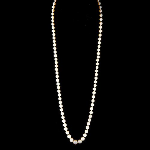 Antique Single Strand Ninety One (91) Graduated White Pearl Necklace with 14 Karat White Gold Clasp.