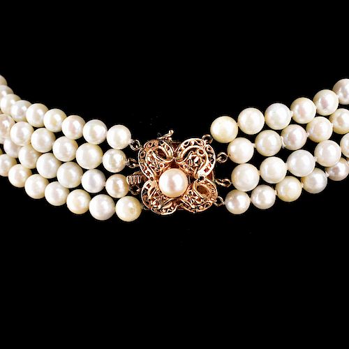 Vintage Four Strand 8mm White Pearl and 14 Karat Yellow Gold Necklace. Stamped 14K to clasp, Pearls with good polish and luster. 