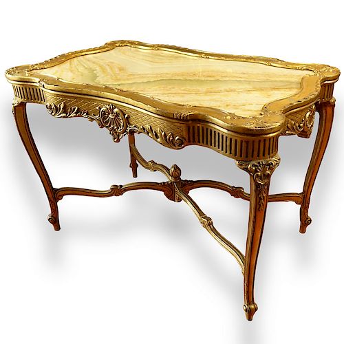 Early 20th Century Carved and Gilt Wood Center Table with Onyx Top.