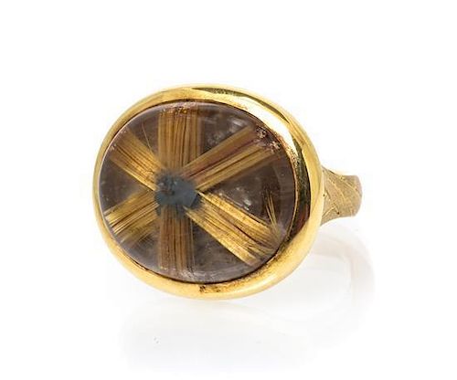 An 18 Karat Yellow Gold, Rutile and Hematite Included Quartz Ring, 25.60 dwts.
