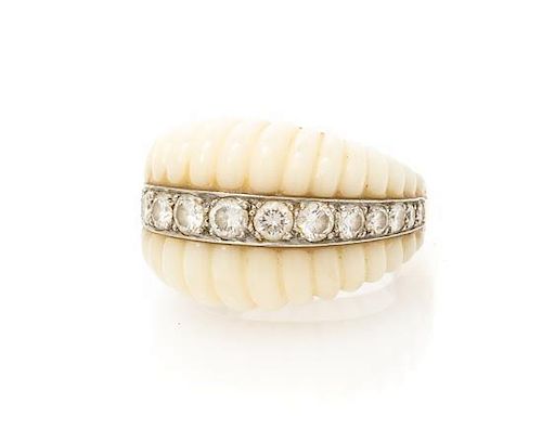 An 18 Karat Yellow Gold, White Coral and Diamond Ring, 9.26 dwts.