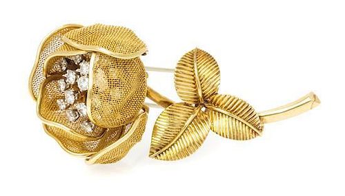 An 18 Karat Yellow Gold and Diamond Articulated Flower Brooch, 19.40 dwts.