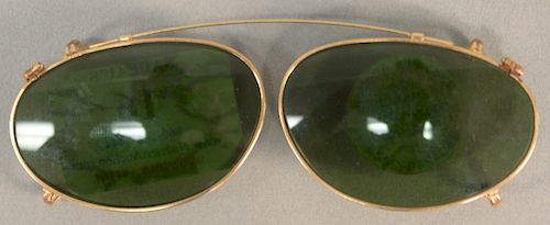10 karat gold framed sunglass frames. length 4 1/4 inches.   Provenance: Estate of Peggy & David Rockefeller having stamp/label.