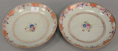 Pair of Chinese export deep plates having central floral design surrounded by enameled rings and basket weave designs along with a n...