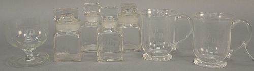 Group of seven crystal Rockefeller monogrammed pieces to include four small bottles with stoppers monogrammed "MR", pair of cups wit...