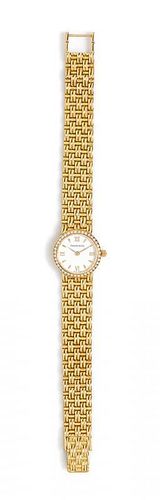 An 18 Karat Yellow Gold and Diamond Wristwatch, Tiffany & Co., 30.40 dwts.