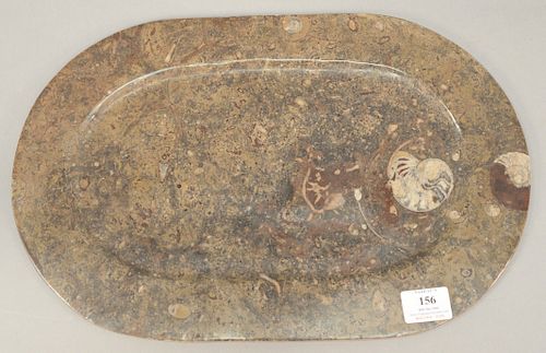 Unusual polished stone oval tray with shell fossils. 11 1/2" x 17 3/4".   Provenance: Estate of Peggy & David Rockefeller having...