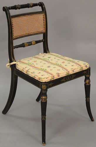 Sheraton side chair with original paint and stenciling having caned seat and back. 

Provenance: Estate of Peggy & David Rockefeller...
