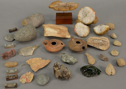 Tray lot of ancient and fossilized items to include two ancient Roman clay oil lamps, fossilized fish and horn, carved quartz (as is...