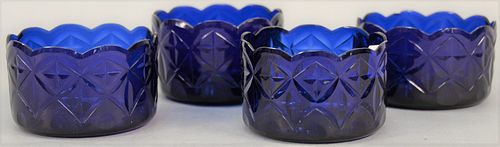 Set of four English or Irish cobalt blue glass finger bowls, 18th/19th century having scallop cut beveled edge and sides having cut...