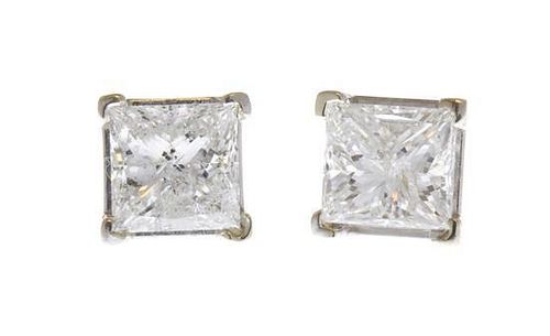 A Pair of 14 Karat White Gold and Diamond Earrings, 1.30 dwts.