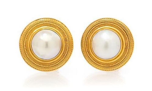 A Pair of 22 Karat Yellow Gold and Cultured Mabe Pearl Earclips, 15.75 dwts.