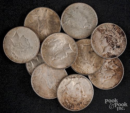 Ten Peace silver dollars.
