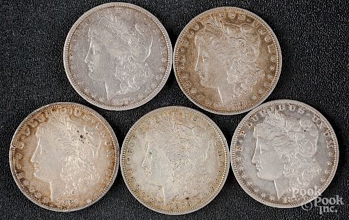 Five Morgan silver dollars