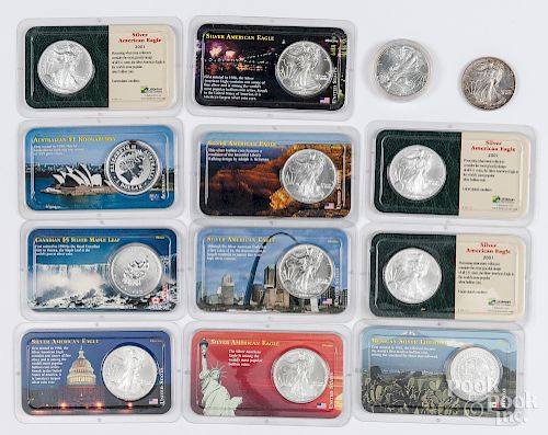 Thirteen 1 ozt fine silver coins.