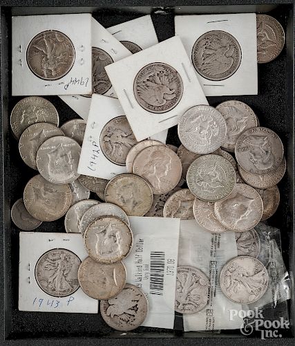 US coins, mostly half dollars.