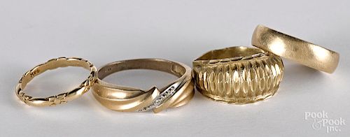 Three 10K gold rings, together with a 14K ring
