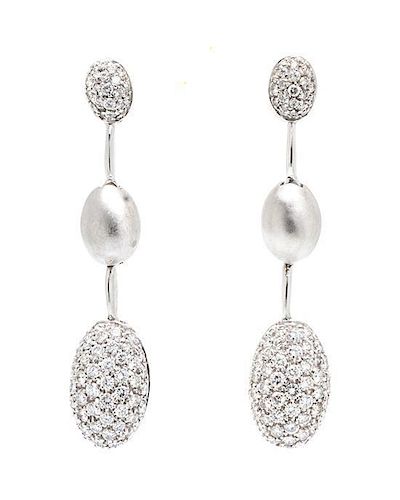 A Pair of Platinum and Diamond Earrings, 7.80 dwts.