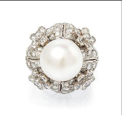An 18 Karat White Gold, Cultured Pearl and Diamond Ring, 11.05 dwts.