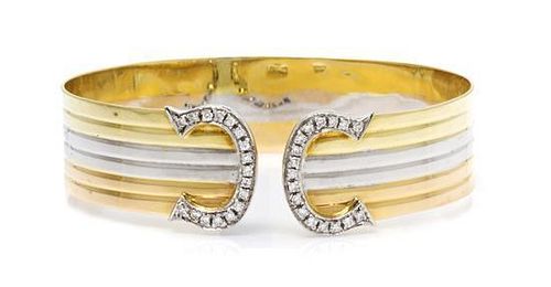 An 18 Karat Tricolor Gold and Diamond Bangle Bracelet, 16.50 dwts.