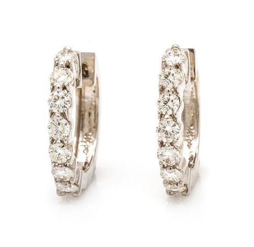 A Pair of 14 Karat White Gold and Diamond Hoop Earrings, 3.20 dwts.