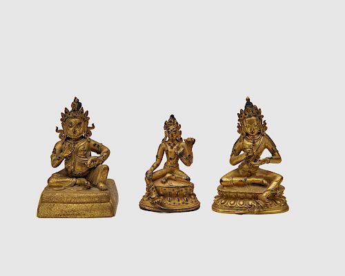 Three Gilt Bronze Figures of Seated Deities