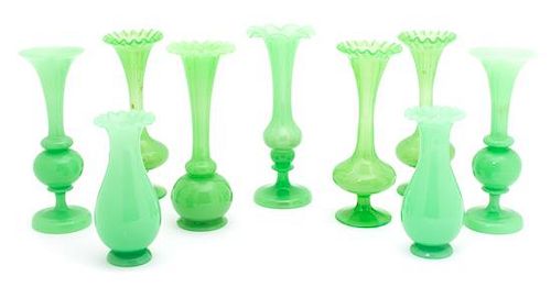 A Group of Nine Green Opaline Glass Bud Vases Height of tallest 8 1/4 inches.