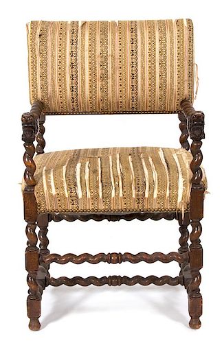 A Jacobean Style Carved Oak Armchair Height 38 1/2 inches
