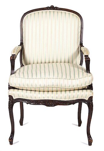 A Louis XV Style Carved Mahogany Fauteuil Height 38 inches.
