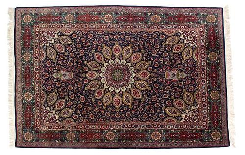 A Tabriz Wool and Silk Rug 8 feet 7 inches x 4 feet 7 inches.