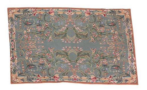 A Needlework Rug 57 1/2 x 37 inches.