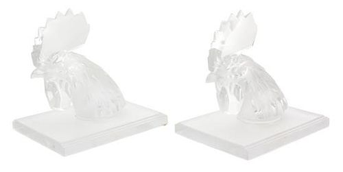 A Pair of Lalique Tete de Coq Molded and Frosted Glass Bookends Height 7 3/4 inches.