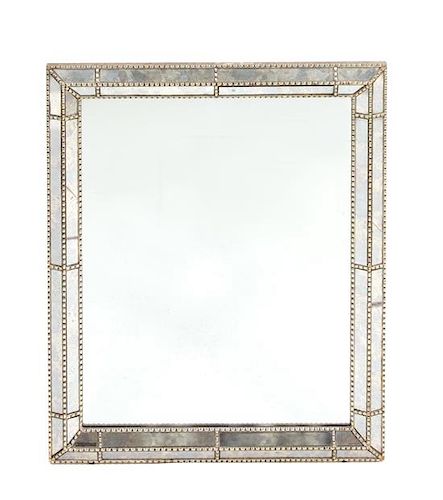 A Wall Mirror with Silvered Wood Frame and Mirrored Glass Inset Panels 36 x 29 1/4 inches.