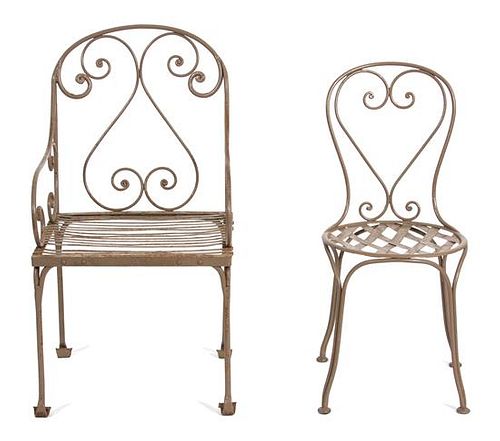A Set of Ten Painted Wrought Iron Outdoor Dining Table and Chairs Height of chairs 32 inches.