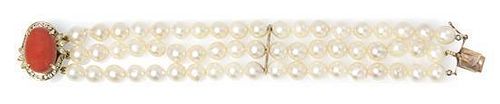 A 14 Karat Yellow, Coral and Diamond Triple Strand Cultured Pearl Bracelet, 28.80 dwts.