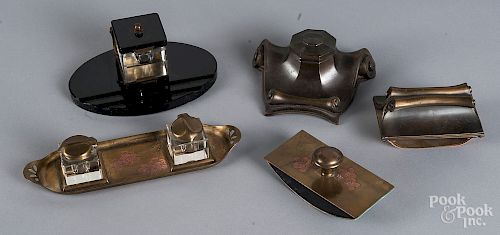 Two Art Nouveau bronze and brass inkwell sets