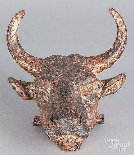 Two cast iron plaques of bulls head and swag