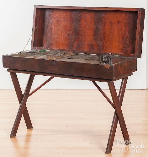 Hammered dulcimer in a mahogany case on stand