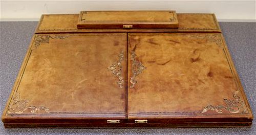 An Italian Gilt-Embossed Leather Travel Desk Top Width 19 3/4 inches.