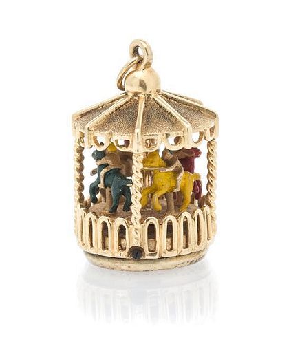 A 14 Karat Yellow Gold and Polychrome Carousel Charm, 12.30 dwts.