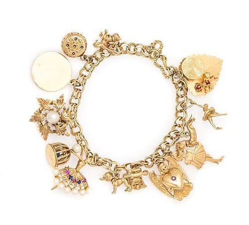 A 14 Karat Yellow Gold Charm Bracelet with 13 Attached Charms, 26.00 dwts.