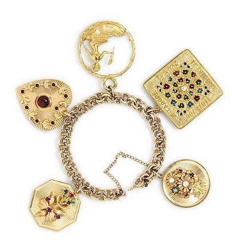 A Yellow Gold Charm Bracelet with Five Attached Charms, 41.20 dwts.
