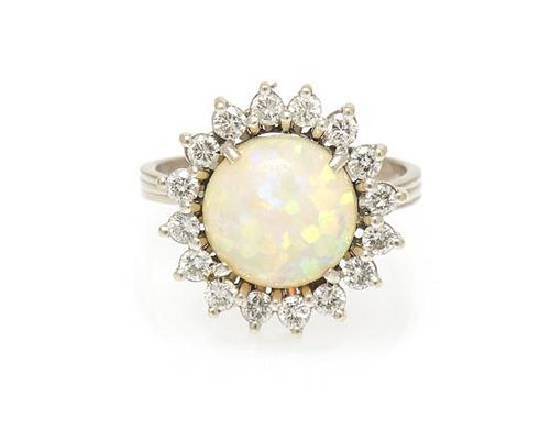 An 18 Karat White Gold, Opal and Diamond Ring, 3.30 dwts.