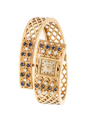 * A 14 Karat Yellow Gold, Sapphire and Diamond Bracelet Watch, Glycine, 30.30 dwts.
