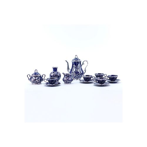 Thirteen (13) Piece German Cobalt Blue Porcelain and Pure Silver Tea Set. Includes: five cups, four