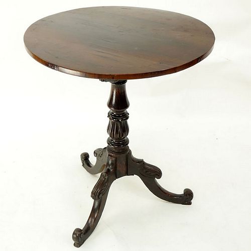 Queen Anne Mahogany Round Tilt Top Table. Carved baluster form stem standing on tri pod feet. Top h