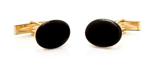 A Pair of 18 Karat Yellow Gold and Onyx Cufflinks, Tiffany & Co., 6.90 dwts.